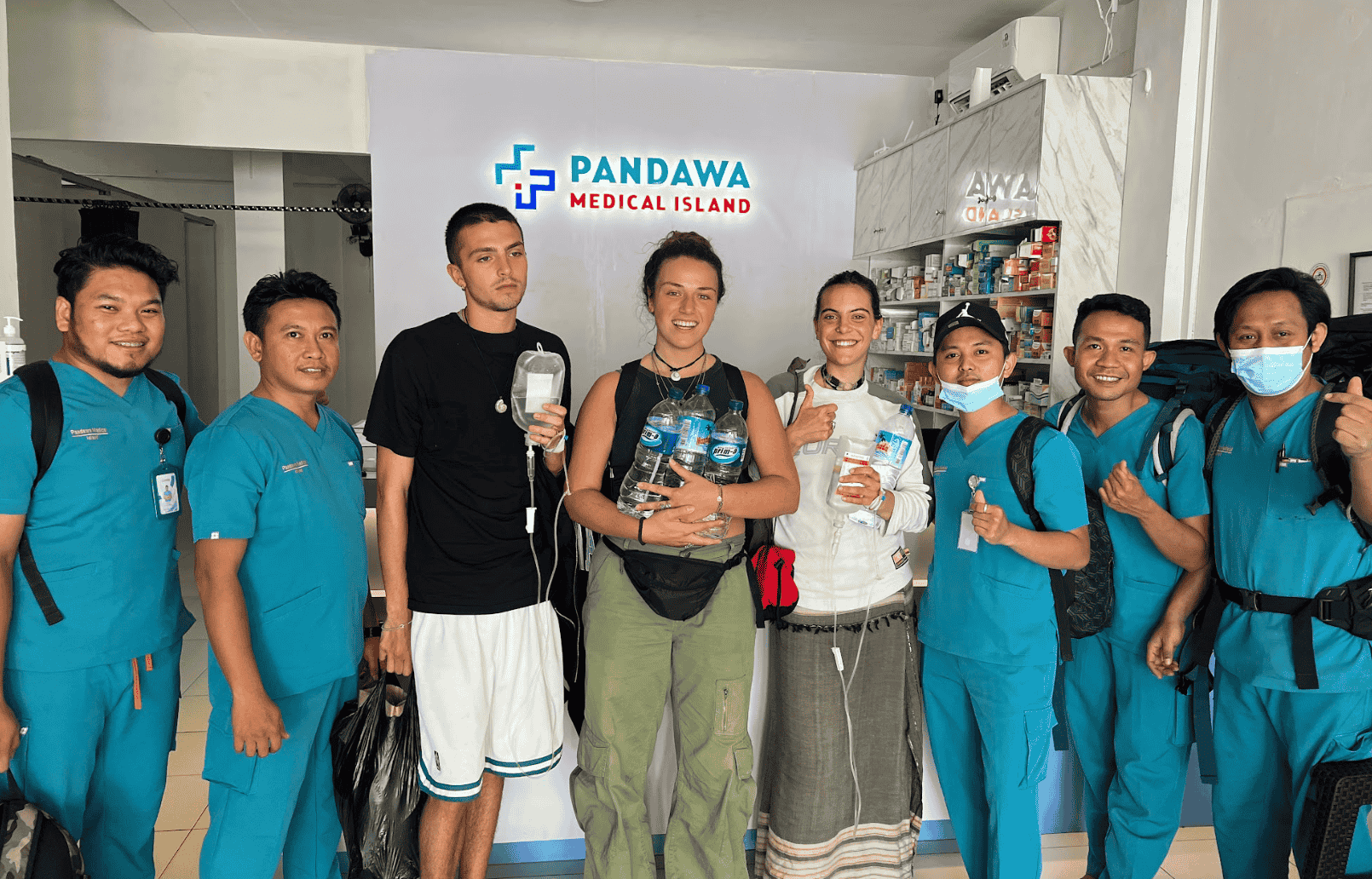 Healthcare professionals and patient marking successful treatment