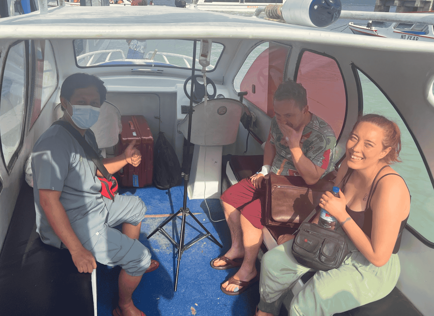 Doctor transporting patient via speedboat for medical evacuation