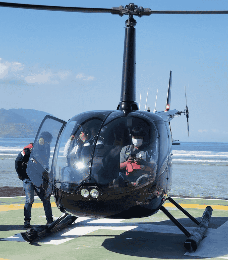 Medical professional providing emergency care inside helicopter